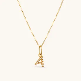 A Crystal Initial Necklace in Gold